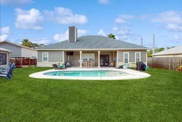 Panama City Beach private vacation home fenced, backyard, with salt water private pool, with lounge