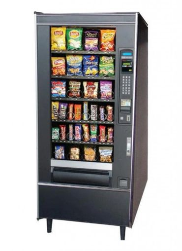 A snack vending machine filled with chips and candy bars.