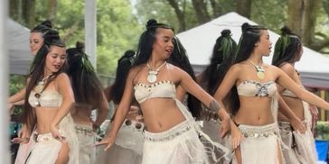 Group of women dancing in traditional attire.