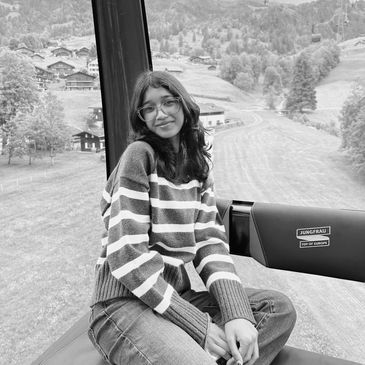 A young woman enjoying a scenic cable car ride in Jungfrau, Switzerland.