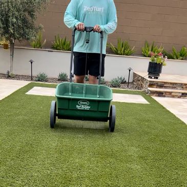 Applying ZeoFill infill to lower turf surface temperatures for pet paws in the Arizona heat."