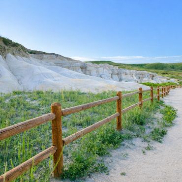 Wood split rail fence installation along a public pathway by Contract Equipment Operators in Colorad