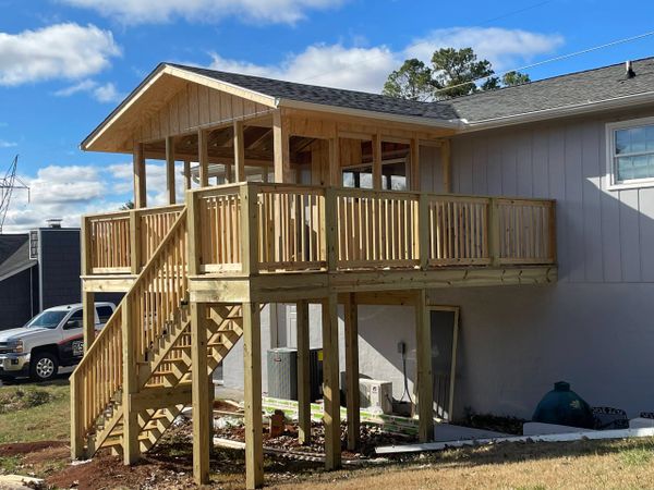 Close up of new second story deck being built.