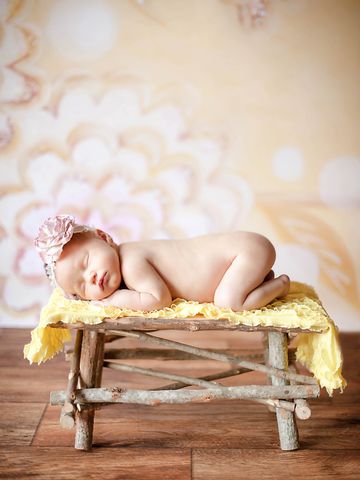 Selfoss Iceland Newborn Photographer Baby girl on yellow background