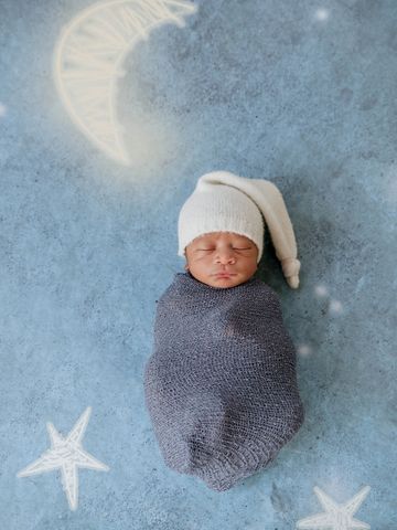 Vik Iceland Newborn Photographer baby on nighttime background