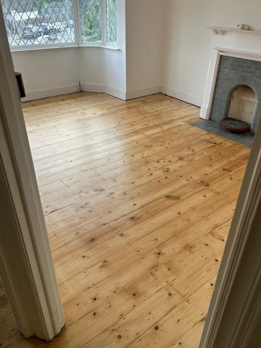 After: Pine floorboards sanded and sealed