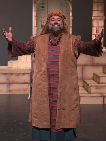 Jethro - man is colorful biblical costume with open arms