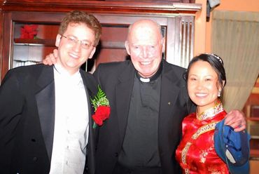 Helpers Craig and Wenqi at their wedding where Msgr presided!