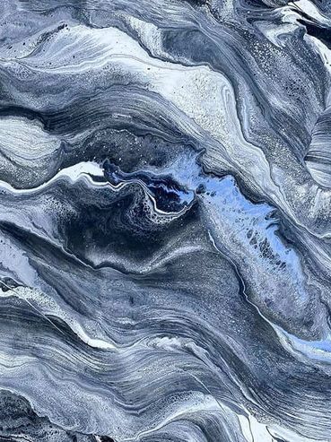 Abstract fluid art with swirling blue and gray tones.