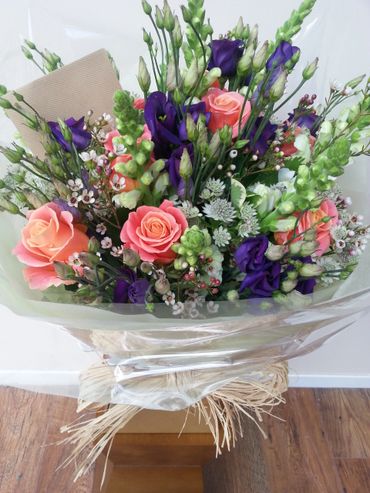 A seasonal mixed gift bouquet in a water bubble, in a gift box