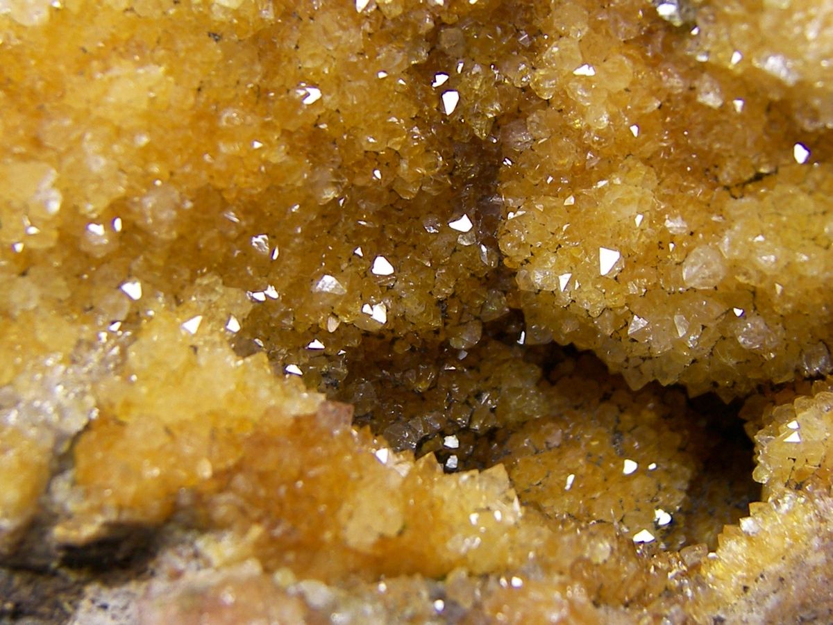 Close-up of yellowish-brown crystalline mineral formation.
