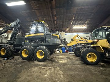 Heavy machinery inside a warehouse or workshop.