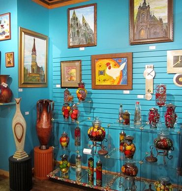 Glass ware and paintings at Purple Pelican Gallery.