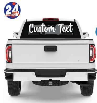White pickup truck with customizable rear window text decal.