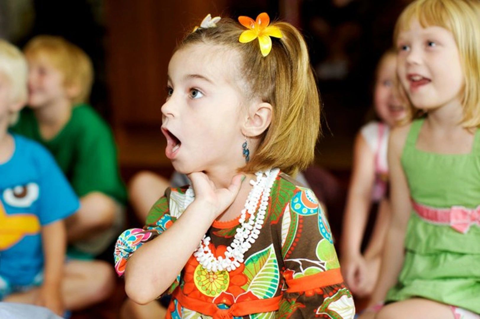 Child gasping in wonder watching professional children's magician in London, Ontario. Kids party