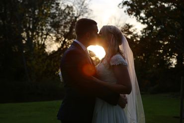 silhouette of couple kissing at dusk