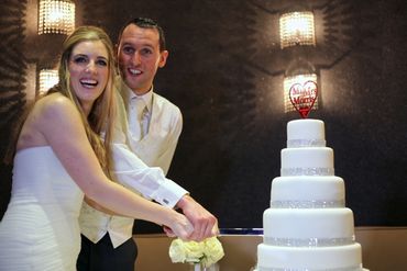 bride + groom cutting wedding cake
