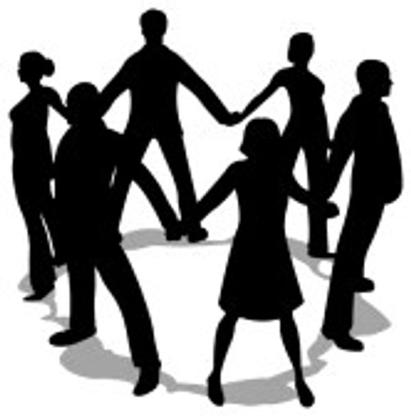 Silhouettes of seven people holding hands in a circle.