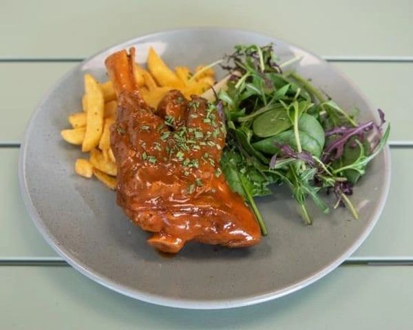 Plate with meat, fries, and salad.