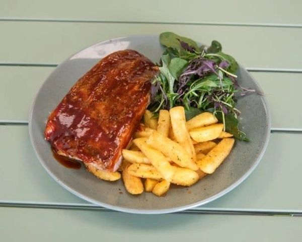 Plate of ribs, fries, and salad.