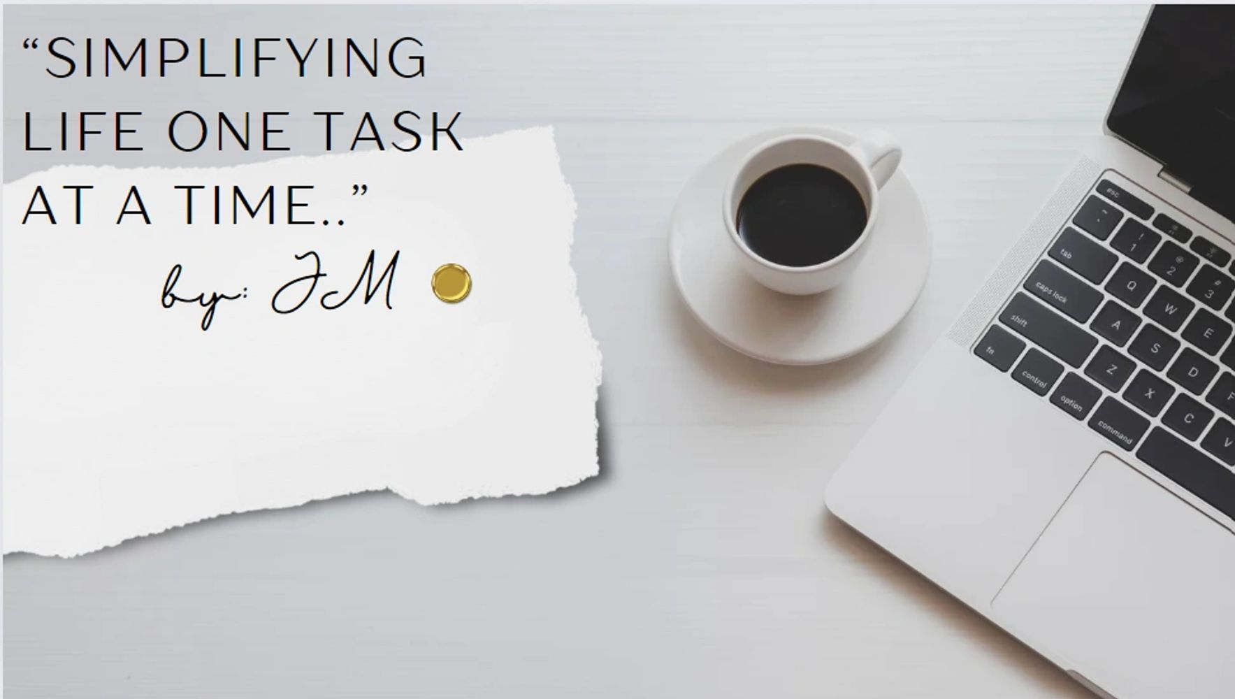 Workspace with a motivational quote, coffee, and a laptop.
