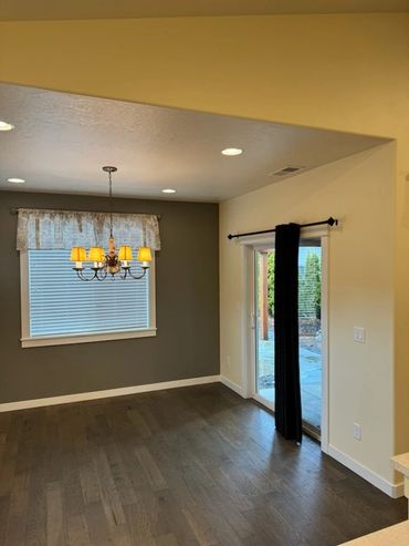 Home entryway with recessed ceiling lights and sliding glass door