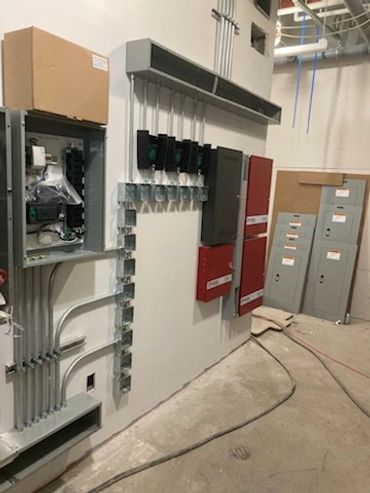 Commercial fuse box and electrical cabinets in hallway space