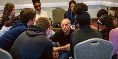 A group of people engaged in a discussion in a circle.