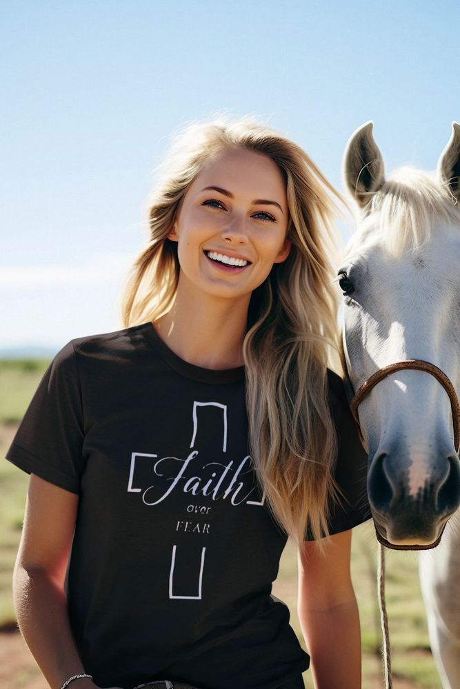 Woman wearing a Faith over fear t-shirt