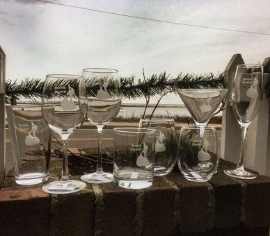 Block Island etched glassware in many styles. Martini, Wine, rocks, stemless, pint and champagne flu