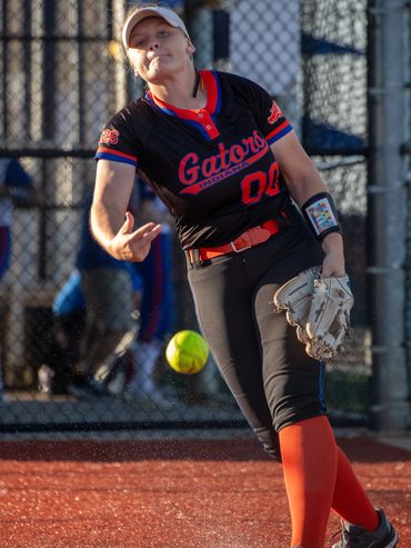 Our sports photographer captured a pitcher warming up before a softball game in Evansville.