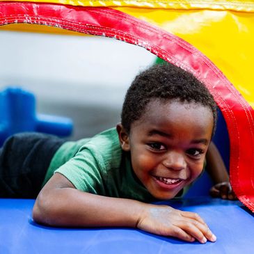 A child enjoying one of Top Flight Inflatables incredible bounce houses.