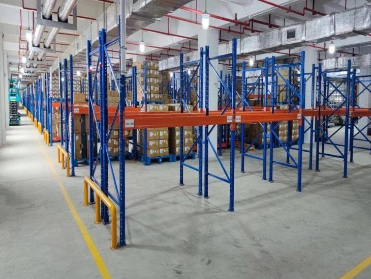 Warehouse with organized shelves and stacked boxes.