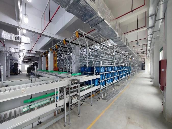 High-tech warehouse with automated conveyor and shelving system.