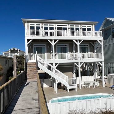 Beach House with a beautiful view and a walkway to the Beach.