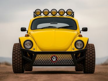 Yellow modified Volkswagen Beetle with off-road tires and roof lights.