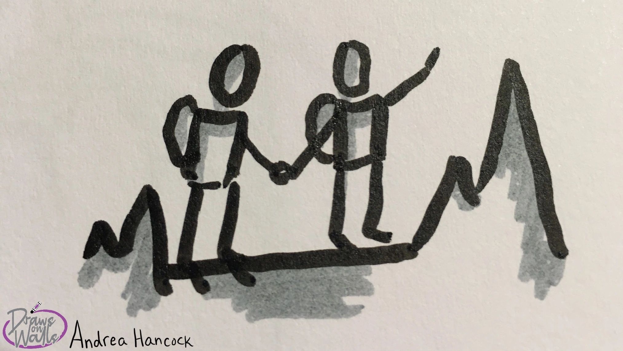 Two people hiking a mountain together