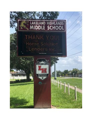 Lakeland Highlands Middle School sign thanking Home Solution Lenders Inc.