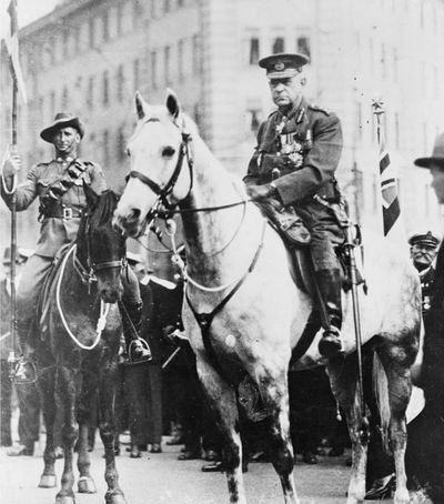 Two military officers on horseback during a formal event or parade.
