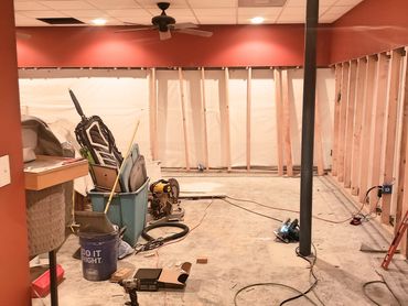 Contractor installing drywall and framing in a home basement renovation project, Montevallo, Jemsion