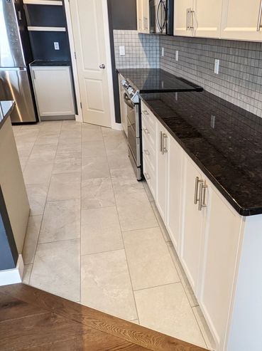 Engineered Hardwood and Glazed Porcelain Tile Flooring, Okotoks, Alberta