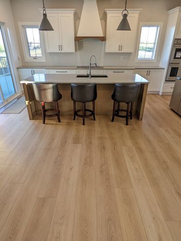 Wide Luxury Vinyl Plank Flooring with Aria Vents, Okotoks, Alberta