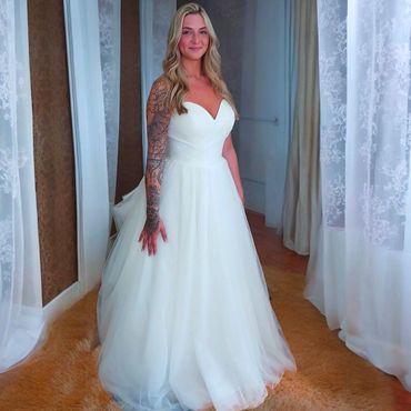 Wedding dress alterations -taken in, 6 layers shortened, and a bustle added.