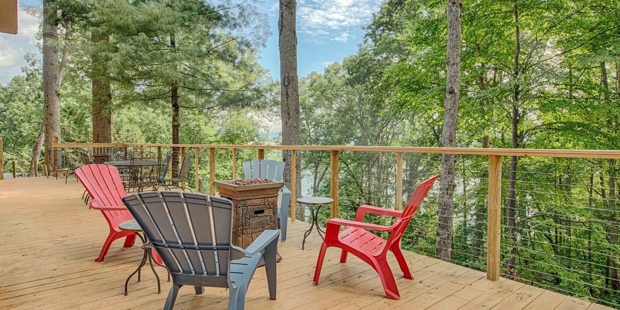 Deck with firepit and seating overlooking Lake Junaluska
