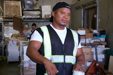 Man working in a wholesale seafood distribution plant.