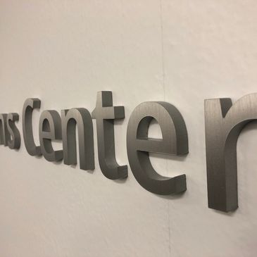 brushed metal dimensional logo