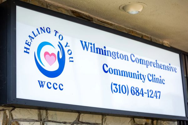 Wilmington Clinic sign with contact information.