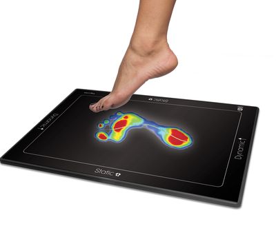 a feet of a person touching a device