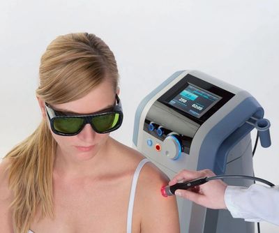 a woman getting Advanced Laser Therapy