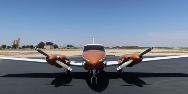 Piper twin-engine Comanche on runway at Tallahassee Airport TLH. Tally Twins Multi-Engine Flight Sch
